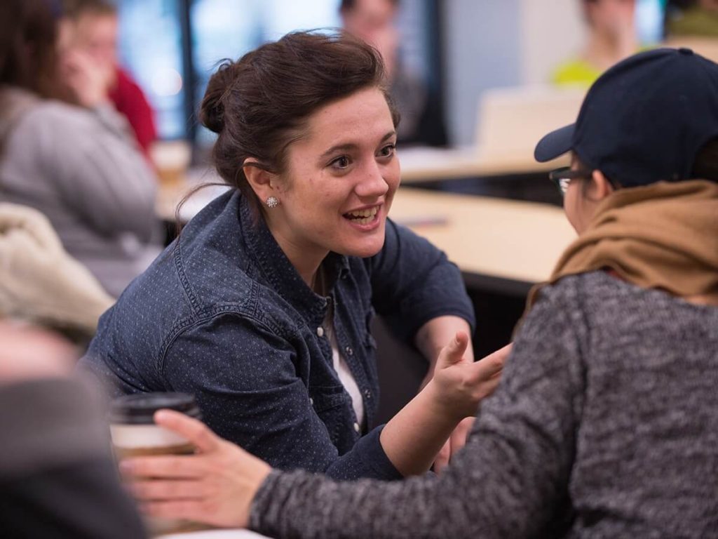 Students conversing in class discussion