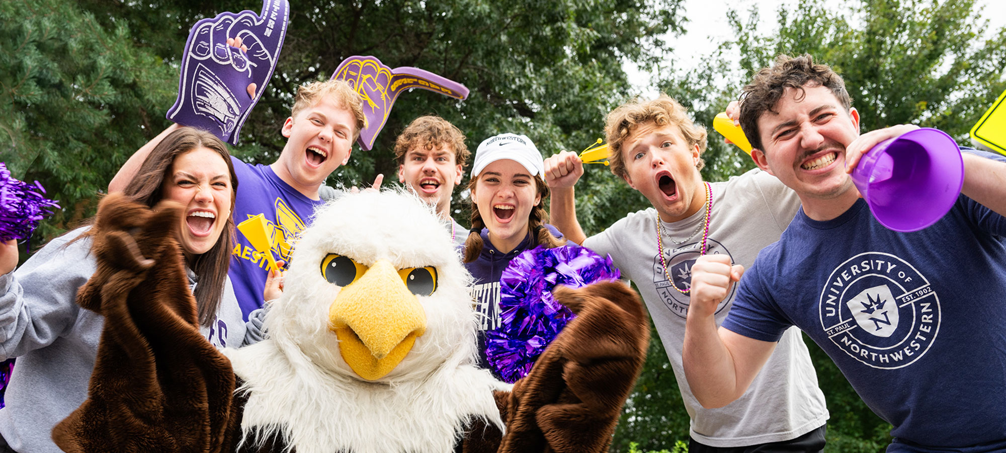 students cheering and wearing UNW apparel.