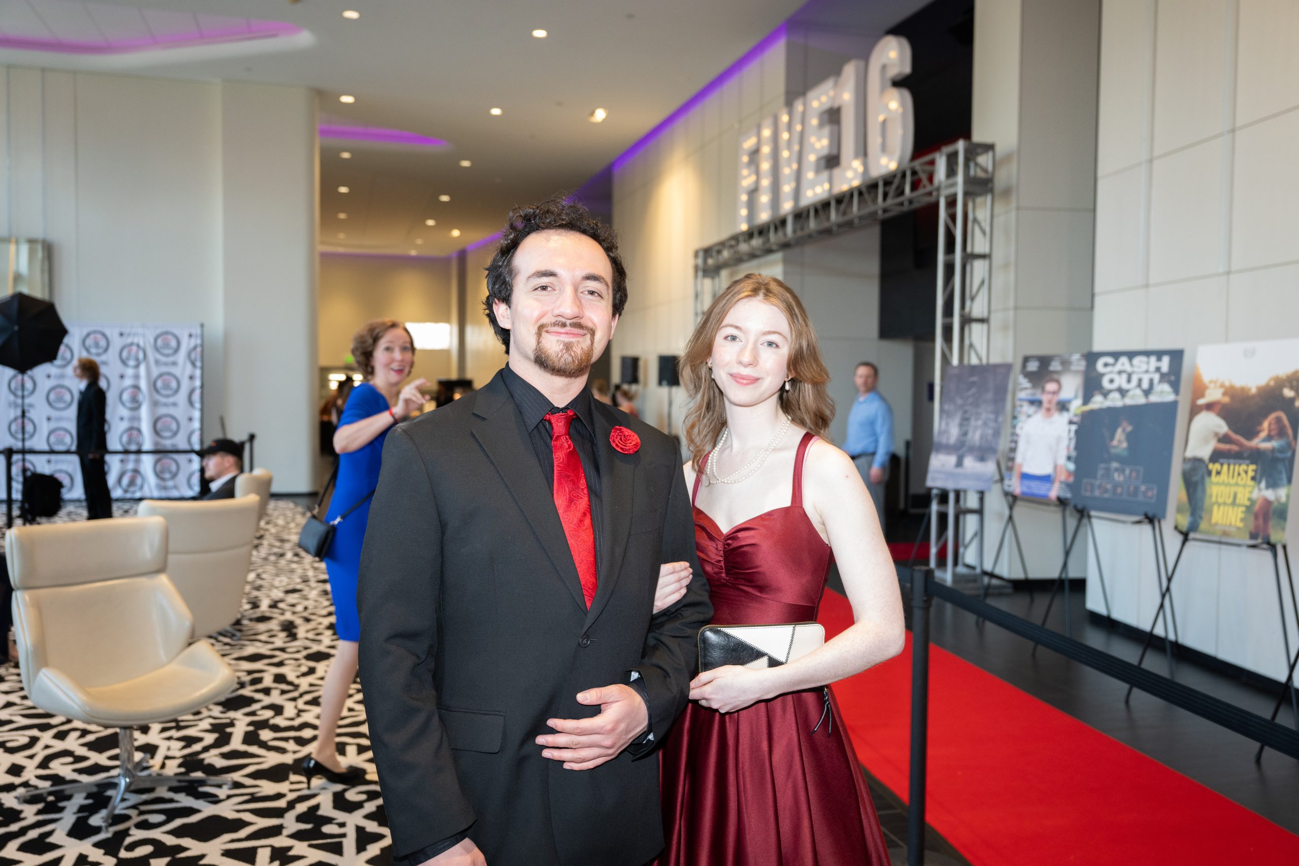 Students posing by the red carpet at Five16.