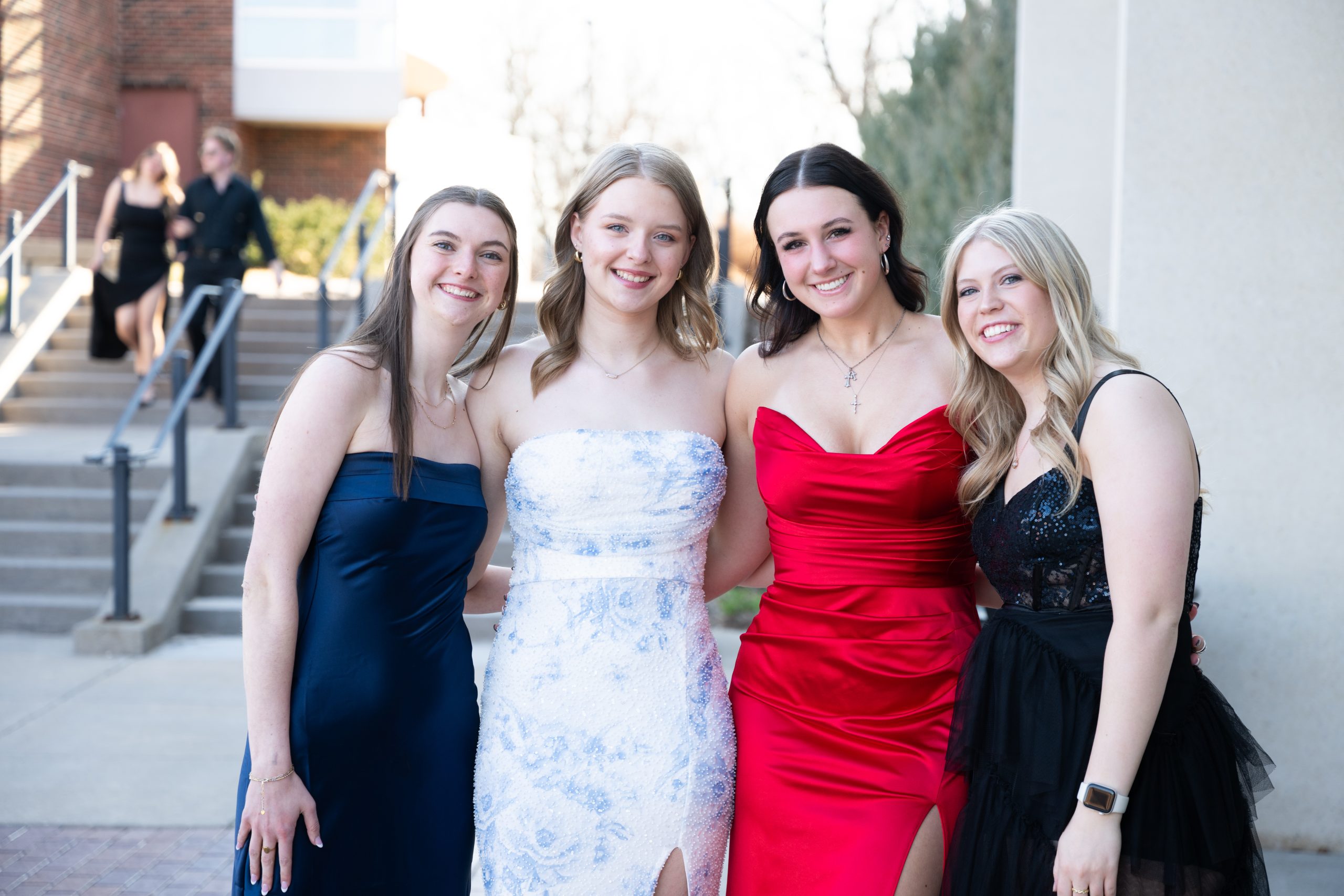 Students posing in front of Totino Fine Arts Center at Five16.