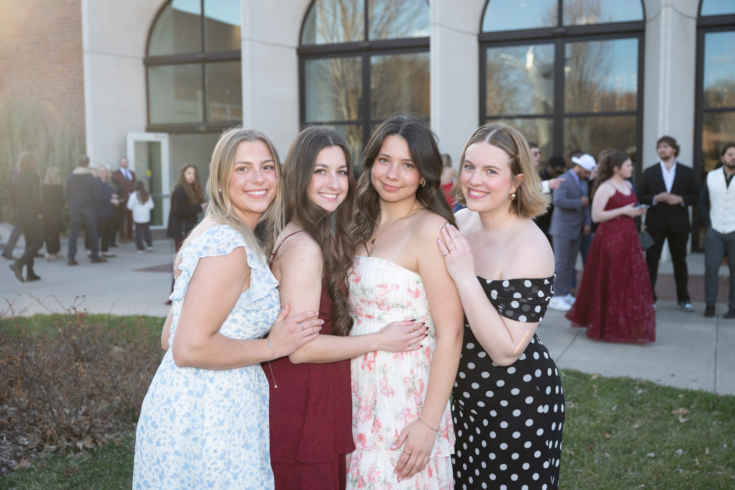 Students posing in front of Totino Fine Arts Center at Five16.