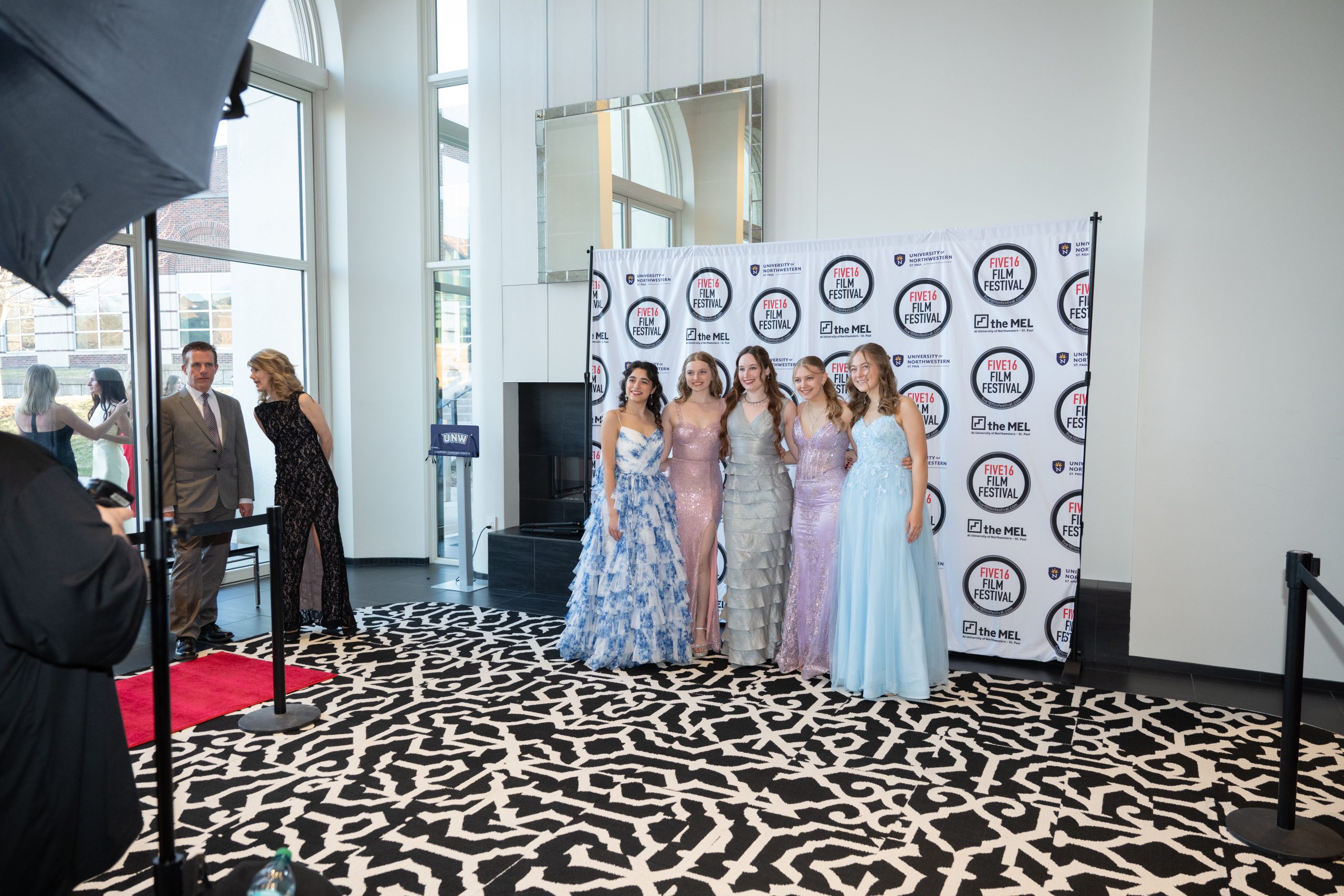 Students posing at Five16 for the photobooth.