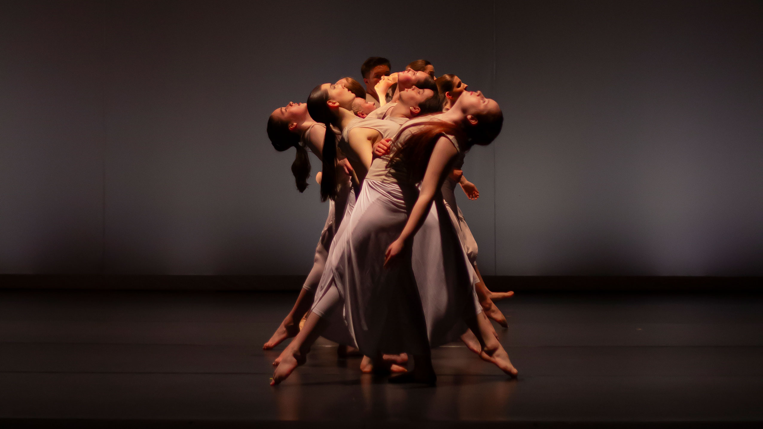 Students dancing in a complex pose.