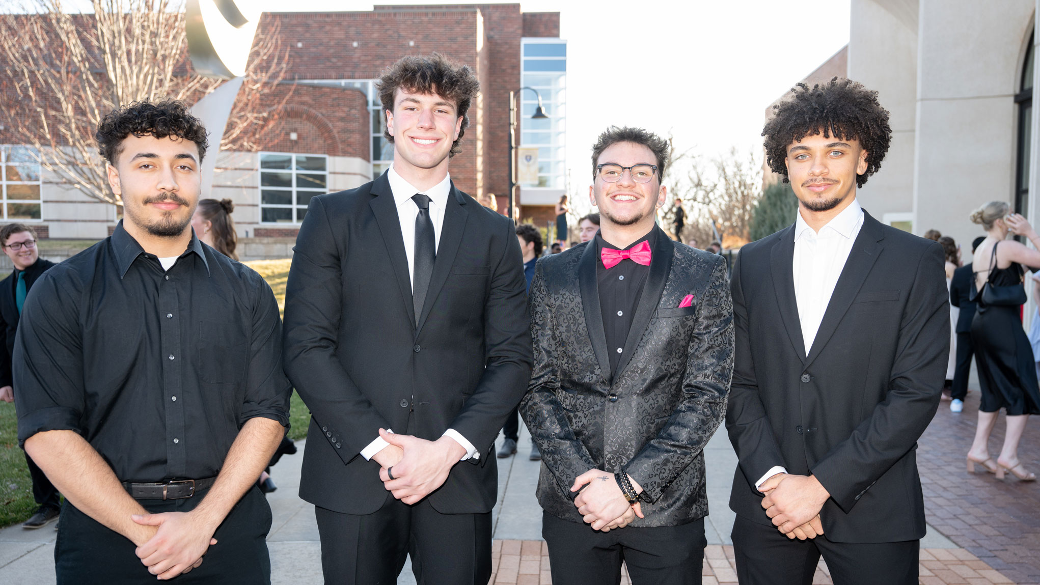 Guys posing in suits for Five16.