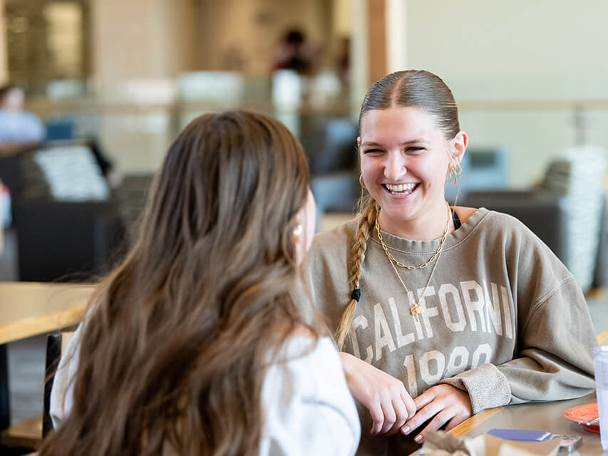 Two students talking together